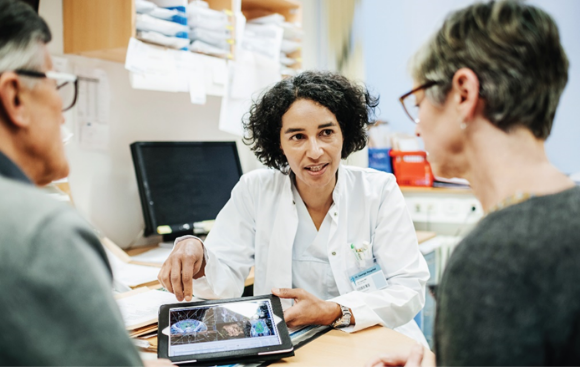 Physician consulting patient(s). Silver in medicine is very common